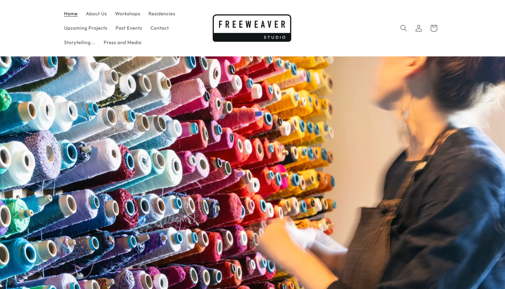Freeweaver Studio London website homepage, with image of a wall of colourful cones of yarn 